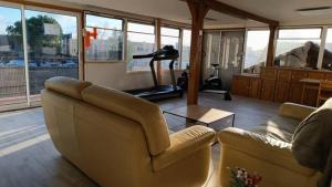 a living room with a couch and a gym at Chez Gaston in Bourges