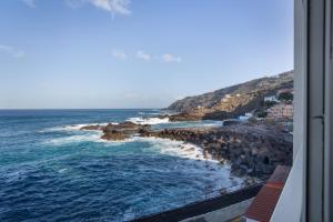 a view of the ocean from a balcony at Milailea in Tacoronte