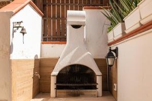 a bird feeder on the side of a building at Solemarevacanze Villasimius in Villasimius