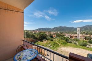 a balcony with a view of the mountains at Solemarevacanze Villasimius in Villasimius