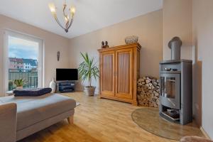 a living room with a wood stove in it at Wohnung Hildesheim in Hildesheim
