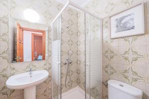 a bathroom with a shower and a sink and a toilet at Villa Son Bibiloni in Algaida +16 photos