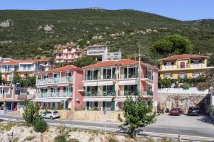 a group of houses on the side of a hill at Apostolos Apartment 2 in Póndi