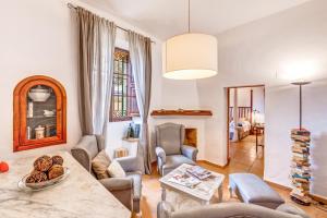 a living room with a couch and a table at Finca Buniferri in Llucmajor