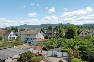 a view of a town with houses and trees at Modern eingerichtetes Apartment in Achern