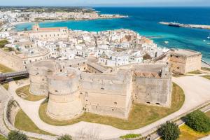an aerial view of an old city with the ocean at Kyma monolocale ad Otranto in Otranto