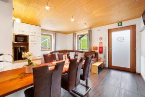 a conference room with a long table and chairs at Joshof Talblick in Moso