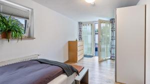 a bedroom with a bed and a window at Ferienwohnung Haas in Bräunlingen +17 photos