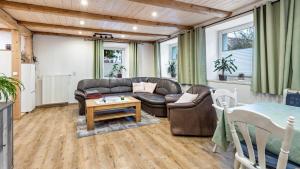 a living room with a couch and a table at Ferienwohnung Haas in Bräunlingen