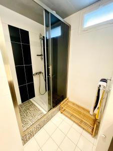 a shower with a glass door in a bathroom at Seignosse Le Penon, maison Patio in Seignosse +33 photos