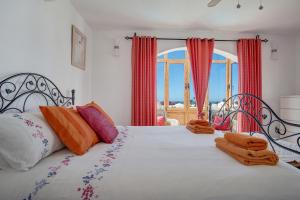a bedroom with a bed with towels on it at Villa Lea in Puerto del Carmen +17 photos