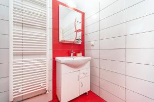 a bathroom with a sink and a mirror at Arianna apartment 17 in Paleokastritsa +13 photos
