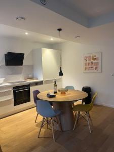 a kitchen with a table and chairs in a room at Feigental in Überlingen
