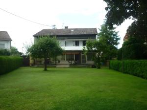 a house with a large lawn in front of it at Haus Bernhardt in Langenargen