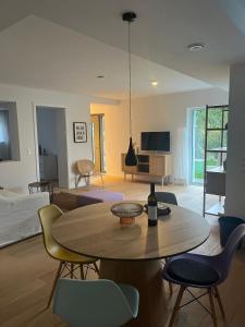 a living room with a table and a couch at Feigental in Überlingen