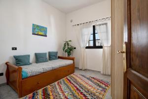 a bedroom with a bed and a window and a rug at La Ratona in Soo