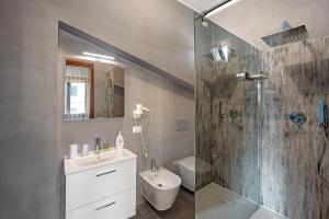 a bathroom with a shower and a sink and a toilet at Villa Gaia in Bordighera +19 photos