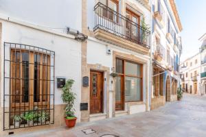 an empty street in an old town with buildings at Can Tosca in Jávea