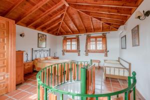 a room with a bed and a glass table at Villa Padial in Torrox