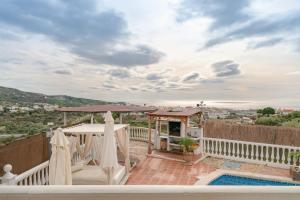 a view from the balcony of a villa with a swimming pool at Villa Padial in Torrox