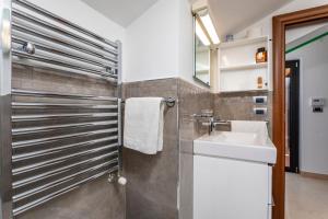 a bathroom with a sink and a mirror at The Amphora Lodging in Furci Siculo +18 photos