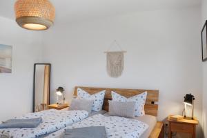 a bedroom with two beds with pillows at Deichblick - in 5 min am Meer in Wangerland