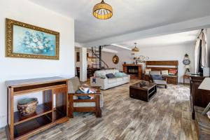 a living room with a couch and a fireplace at Quinta O Refúgio in Azambuja +86 photos