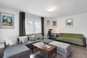 a living room with a couch and a table at Ferienwohnung Zum Hasen in Meschede
