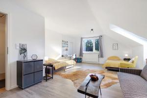 a living room with two beds and a couch at Künzes Domizil in Edemissen