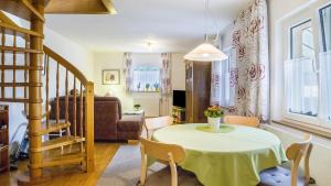 a living room with a table and a chair at Ferienwohnung Ipser in Vogtsburg