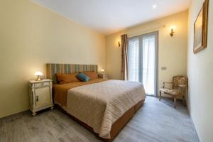 a bedroom with a bed and a window at Abaye 2 Pinot - Charm Adults Only in Soiano del Lago +34 photos