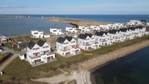 a row of houses on an island in the water at Fewo Ostseeflair by Seeblick Ferien in Kappeln