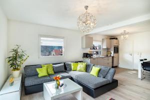 a living room with a couch and a table at Vogtshaus in Gernsbach
