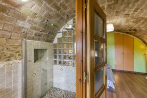a bathroom with a walk in shower and a glass door at Can Cortada in Cantallops +32 photos