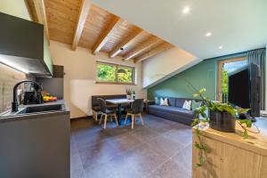 a kitchen and living room with a table and a couch at Wiesgut Ferienwohnung Gala in Tesimo +9 photos