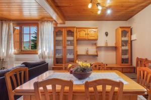 a kitchen and dining room with a table and chairs at Hospitalillo in Sant Corneli de Cercs 