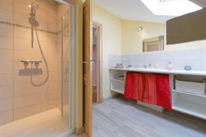 a bathroom with a shower and a sink at Le Guitou de Monlezun in Monlezun +30 photos
