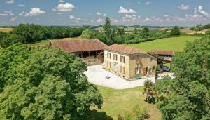 an aerial view of a house in a field at Le Guitou de Monlezun in Monlezun