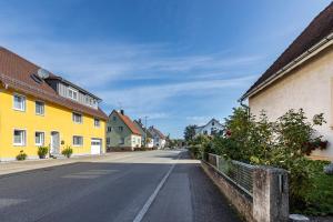 an empty street in a town with houses at Ferienwohnung Hewenpanorama 1 in Engen