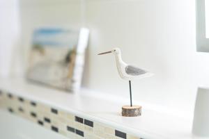 a small bird figurine on a counter in a bathroom at Hof Helmenhube 1 in Oberzent +19 photos