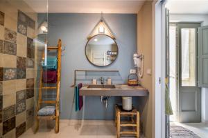 a bathroom with a sink and a mirror at La dimora Elia' in Muro Leccese +19 photos