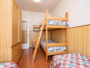 a bedroom with two bunk beds and a bed at Casa Camilla in Manerba del Garda