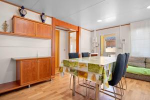 a dining room and living room with a table and chairs at La Marquesa in Camarles