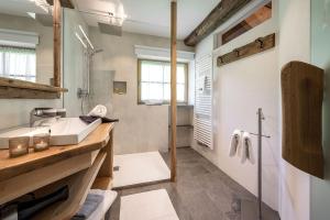 a bathroom with a sink and a shower at Bergblick App Fichte in Villnoss +26 photos
