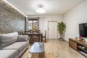 a living room with a couch and a table at El Cierzo de Sediles in Sediles