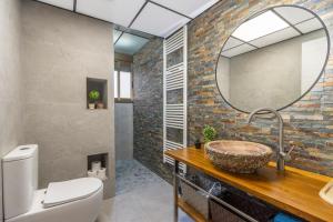 a bathroom with a sink and a mirror at El Cierzo de Sediles in Sediles +21 photos
