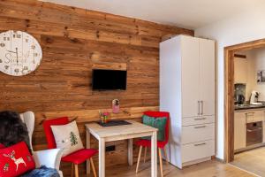 a kitchen and dining room with a table and chairs at Haus Excelsior Top 36 in Seefeld in Tirol