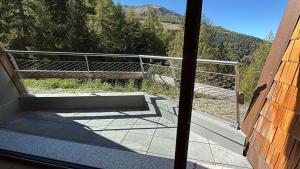 a balcony with a view of a mountain at Secret Place - Pila Appartamenti in Pila