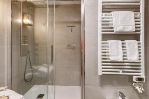 a bathroom with a shower with white towels at Chalet Sambor in Oga +58 photos