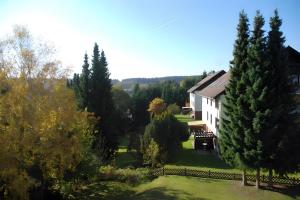 an aerial view of a house and trees at Wurmbergzauber Sonnenschein in Braunlage +13 photos